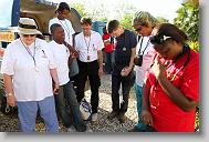 From Rebecca Buck from Belhaven, Schneider Dorcela, Jennifer Julsaint, David Duritza, from Bland County, VA., Samuel Winkler,  Dr. Kevin Maupin,  from Pensacola, FL., and Dr. Merline Milien, right, say a prayer  before departing for a clinic in a church in  Bon Repos, Haiti, Monday May 3, 2010.  ETHAN HYMAN  - ehyman@newsobserver.com