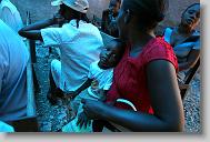 Destin Dorlens, 3, waits with his mother Mariola St. Louis to be seen during  a clinic run by the North Carolina Baptist Men in a church in  Bon Repos, Haiti, Monday May 3, 2010.  ETHAN HYMAN  - ehyman@newsobserver.com