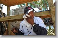 Hans Frazilus from Cary tries to cool down after  helping build a shelter as volunteers with the North Carolina Baptist Men Disaster Relief build houses in Titanyen Haiti Monday May 3, 2010.   ETHAN HYMAN  - ehyman@newsobserver.com