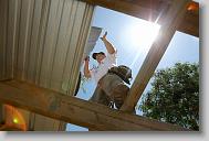Christopher Yarboro of Roxboro works on a roof as volunteers with the North Carolina Baptist Men Disaster Relief build houses in Titanyen Haiti Monday May 3, 2010.   ETHAN HYMAN  - ehyman@newsobserver.com