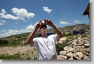 Larry Kingsley of Cary takes pictures as volunteers with the North Carolina Baptist Men Disaster Relief build houses in Titanyen Haiti Monday May 3, 2010.   ETHAN HYMAN  - ehyman@newsobserver.com