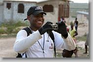 Tru Pettigrew takes a photo as volunteers with the North Carolina Baptist Men Disaster Relief build houses in Titanyen Haiti Monday May 3, 2010.   ETHAN HYMAN  - ehyman@newsobserver.com