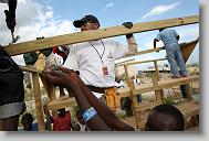 Tru Pettigrew, center, helps with Haitian volunteers  as volunteers with the North Carolina Baptist Men Disaster Relief build houses in Titanyen Haiti Monday May 3, 2010.   ETHAN HYMAN  - ehyman@newsobserver.com