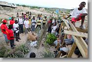 Dieuner Joseph preaches to Haitians after finishing work for the day as  volunteers with the North Carolina Baptist Men Disaster Relief build houses in Titanyen Haiti Monday May 3, 2010.   ETHAN HYMAN  - ehyman@newsobserver.com