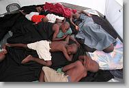 At 5 a.m., the boys are all asleep in their tent at the Yahve-Jire Children's Foundation in Tabarre, Haiti Thursday May 6, 2010.  Ever since the earthquake, the children have slept outside.  The tent is 8x8.   The orphanage is supported by Western Boulevard Presbyterian Church.  ETHAN HYMAN  - ehyman@newsobserver.com