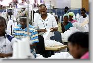 Louissant Solon, 36,  works in the sewing operation for AGA Corp. in Port au Prince Wednesday May 5, 2010.  The plant produces over one million men's t-shirts a week.  ETHAN HYMAN  - ehyman@newsobserver.com
