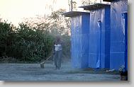 Ginette Daphnis sweeps outside her shelter  constructed by Samaritan's Purse in Lafito, Haiti, Thursday May 6, 2010. The camp with rows of shelters and access to latrines and potable water is designed to help reduce the spread of insect borne diseases.  ETHAN HYMAN  - ehyman@newsobserver.com