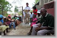 A prayer is said before a medical clinic by volunteers with the North Carolina Baptist Men Disaster Relief team in Cabaret, Haiti Friday May 7, 2010.  ETHAN HYMAN  - ehyman@newsobserver.com