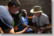 Dr. Bill Harden of Rocky Mount, right, works with Lisette Derius, 68, during a medical clinic by volunteers with the North Carolina Baptist Men Disaster Relief team in Cabaret, Haiti Friday May 7, 2010.  Helping out is Stephen Winchell with ALERT, a Christian training and service organization.  ETHAN HYMAN  - ehyman@newsobserver.com