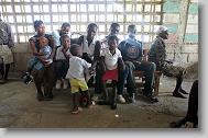 Patients wait their turn to be seen during a medical clinic by volunteers with the North Carolina Baptist Men Disaster Relief team in a schoolhouse in Cabaret, Haiti Friday May 7, 2010.  ETHAN HYMAN  - ehyman@newsobserver.com