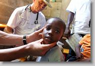 Jean Marvine, 5, is checked during a medical clinic by volunteers with the North Carolina Baptist Men Disaster Relief team in Cabaret, Haiti Friday May 7, 2010.  ETHAN HYMAN  - ehyman@newsobserver.com