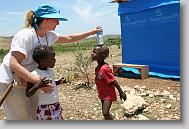Anne Ross plays with Sandia Joseph, 4, and Jenelson Batizan, 2, right, during the last day  of working in Titanyen for this group of the North Carolina Baptist Men Disaster Relief team in Titanyen, Haiti Friday May 7, 2010.  ETHAN HYMAN  - ehyman@newsobserver.com