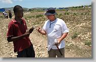 Chris Yarboro of Roxboro gives one of his tools to Sonson Pierre, 15, during the last day  of working in Titanyen for this group of the North Carolina Baptist Men Disaster Relief team in Titanyen, Haiti Friday May 7, 2010.  ETHAN HYMAN  - ehyman@newsobserver.com