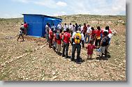 A prayer is said in front of a new shelter during the last day  of working in Titanyen for this group of the North Carolina Baptist Men Disaster Relief team in Titanyen, Haiti Friday May 7, 2010.  ETHAN HYMAN  - ehyman@newsobserver.com