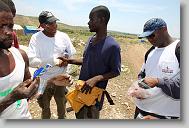 Tru Pettigrew of Cary says goodbye to Lafalaise Jean Reginald after giving him his tool belt during the last day  of working in Titanyen for this group of the North Carolina Baptist Men Disaster Relief team in Titanyen, Haiti Friday May 7, 2010.  ETHAN HYMAN  - ehyman@newsobserver.com