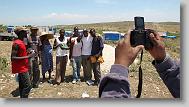 Hans Frazilus from Cary takes a photo of Tru Pettigrew and his friends during the last day  of working in Titanyen for this group of the North Carolina Baptist Men Disaster Relief team in Titanyen, Haiti Friday May 7, 2010.  ETHAN HYMAN  - ehyman@newsobserver.com